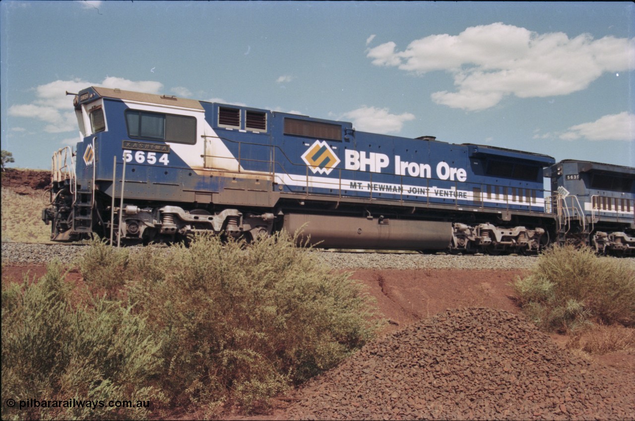 235-23
Yandi One, BHP Iron Ore Goninan rebuild CM40-8M GE unit 5654 'Kashima' serial 8412-11 / 93-145 sits on a loaded train awaiting departure time and also has the late marigold style BHP logo.
Keywords: 5654;Goninan;GE;CM40-8M;8412-11/93-145;rebuild;Comeng-NSW;ALCo;M636C;5493;C6084-9;