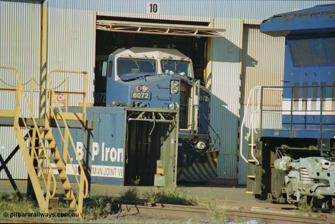 236-05
Nelson Point, Loco Overhaul Shop, BHP AC6000 class locomotive 6072 'Hesta', a General Electric built AC6000 model, serial 51064, seen here in the shed having the windscreen protectors or 'blinkers' fitted.
Keywords: 6072;GE;AC6000;51064;