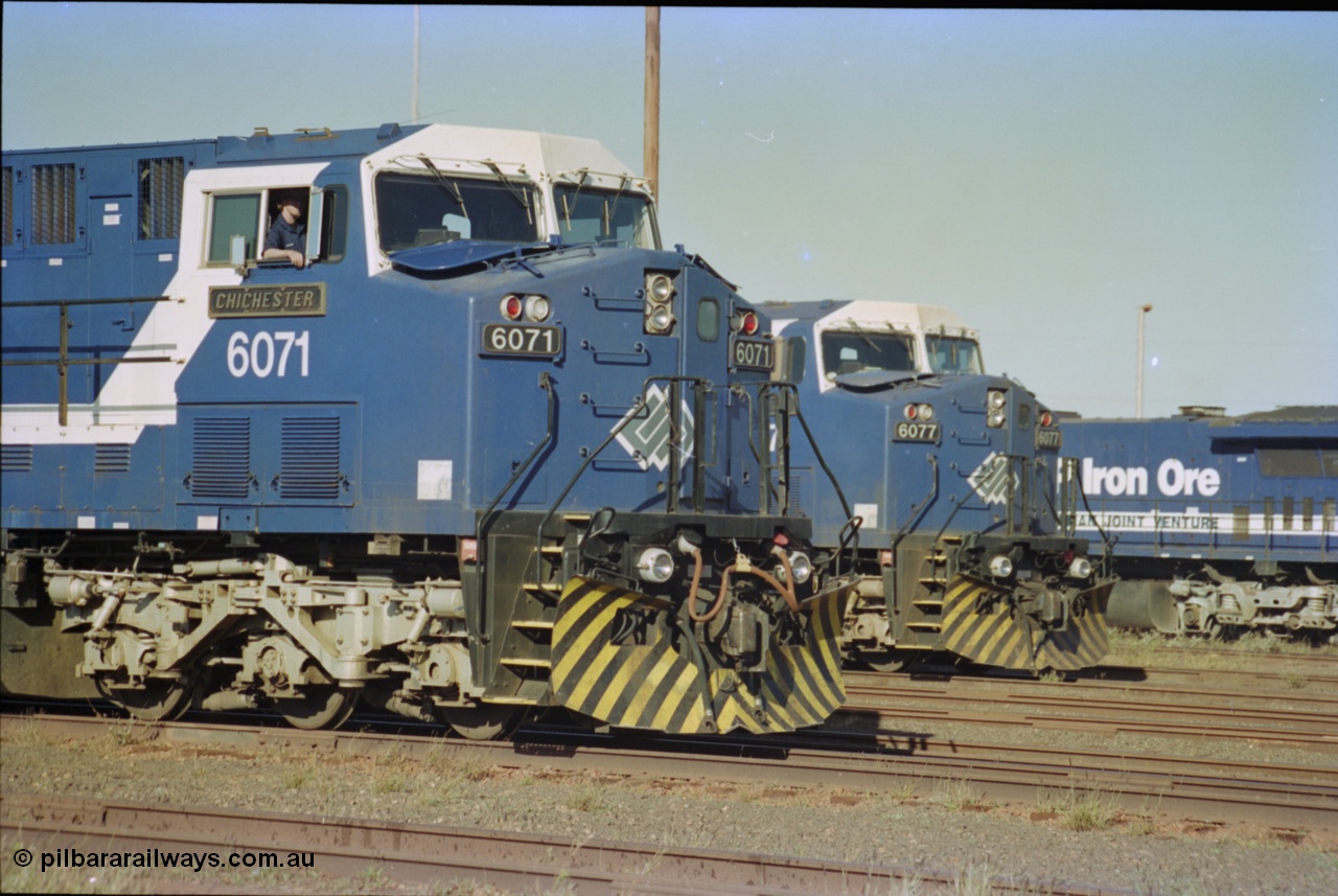 236-31
Nelson Point Loco Overhaul Shop, BHP Iron Ore's General Electric built AC6000 unit 6071 'Chichester' serial 51063 sits out the front with new windscreen protectors or 'blinkers' fitted next to sister unit 6077.
Keywords: 6071;GE;AC6000;51063;