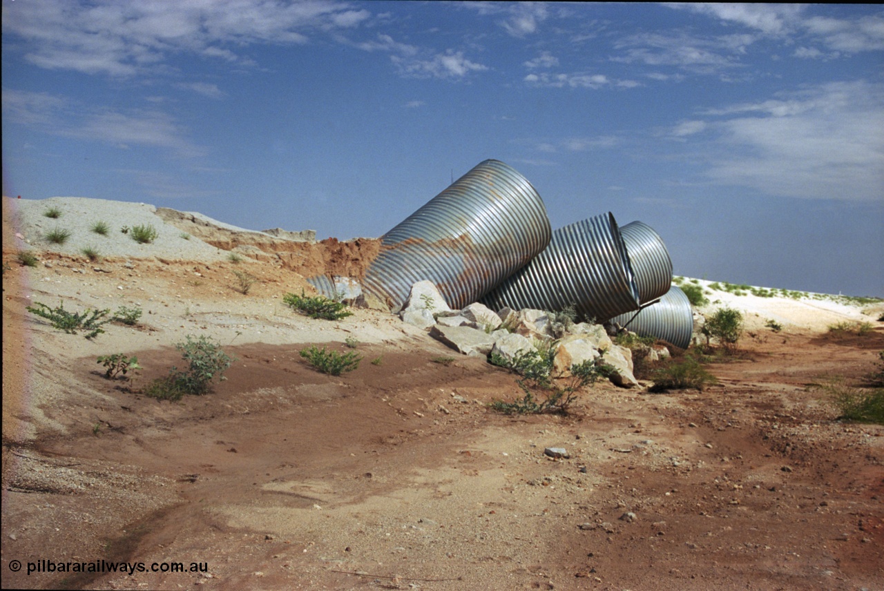 237-02
Water damaged culverts located on the upper reaches of the Edgina Creek, near the Woodstock South location on the BHP Newman line. [url=https://goo.gl/maps/kRVDYtxmRC42] Geo Data [/url].
