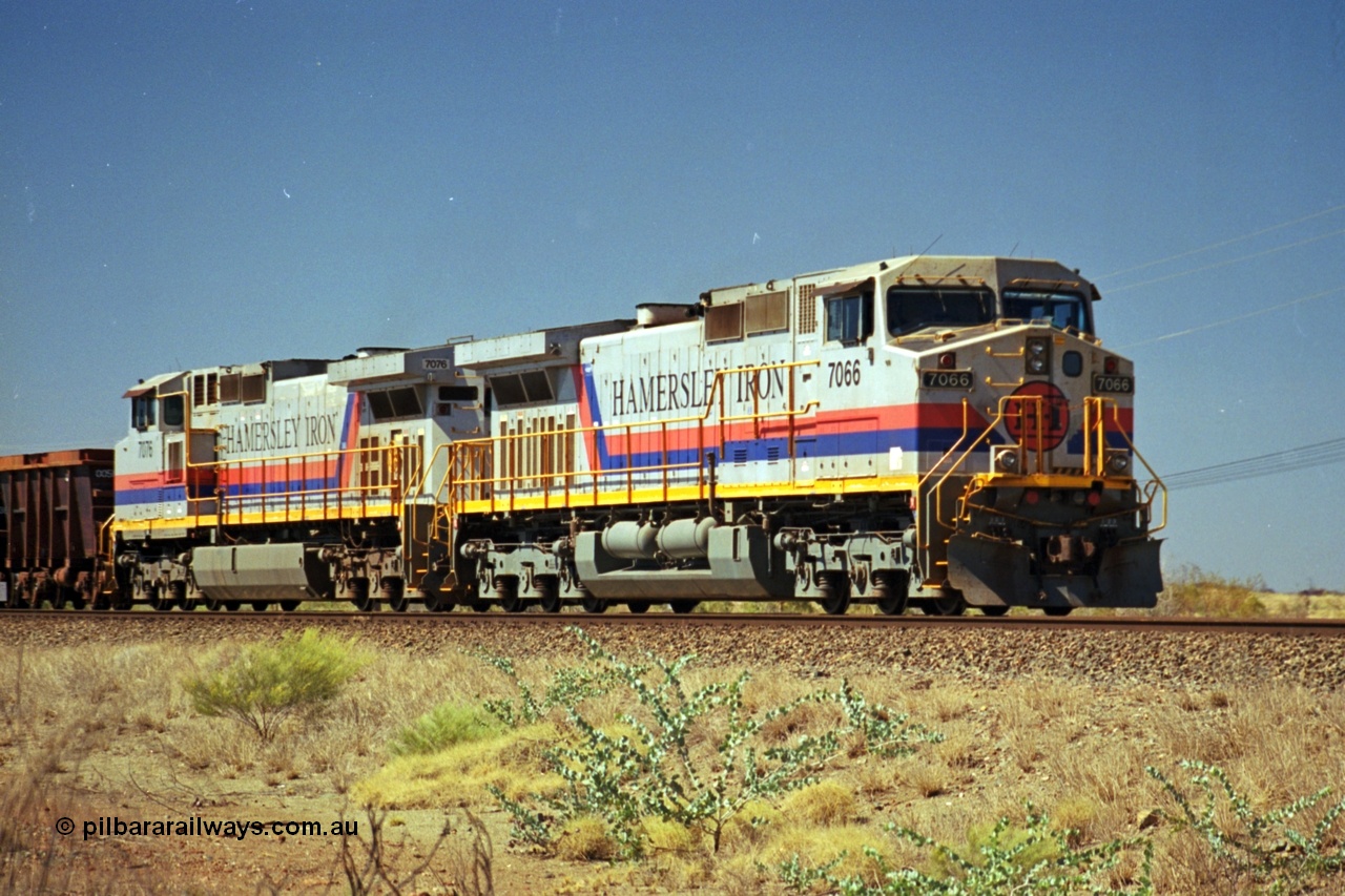 237-34
Dugite Siding, empty train in the passing track behind the standard pair of Hamersley Iron General Electric model Dash 9-44CW units 7066 serial 47745 and 7076 serial 47755. [url=https://goo.gl/maps/6og1H2khBAu] Geodata [/url].
Keywords: 7066;GE;Dash-9-44CW;47745;