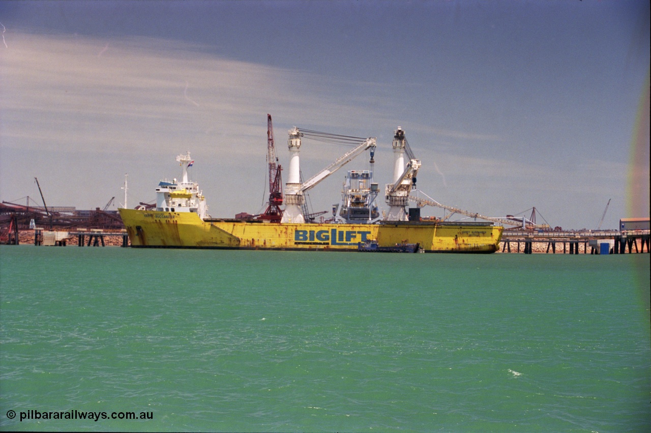 238-01
Port Hedland Harbour, heavy lift ship Happy Buccaneer, call sign PEND (IMO: 8300389) built in 1984 at Hitachi Shipbuilding Osaka Japan as class LRS X 100A1 X LMC UMS, sits at Finucane Island D Berth delivering a new shiploader for BHP Billiton. 1st November 2003. [url=https://goo.gl/maps/vWZoHTsRPsp] Geodata [/url]. Back in time here the ship cranes were only 550 tonne each, these are now 700.
Keywords: Happy-Buccaneer;Hitachi-Shipbuilding-Osaka-Japan;