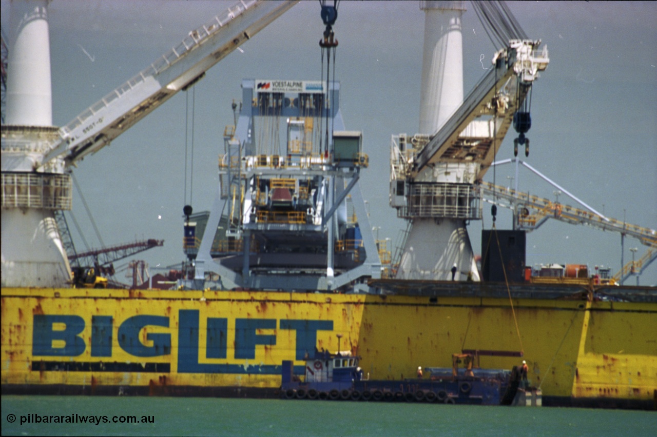 238-04
Port Hedland Harbour, heavy lift ship Happy Buccaneer (IMO: 8300389) sits at Finucane Island D Berth delivering a new shiploader for BHP Billiton. 1st November 2003. [url=https://goo.gl/maps/vWZoHTsRPsp] Geodata [/url]. Back in time here the ship cranes were only 550 tonne each, these are now 700.
Keywords: Happy-Buccaneer;Hitachi-Shipbuilding-Osaka-Japan;