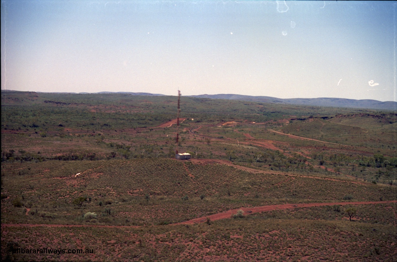 239-06
View from the radial stacker at Yandi One looking north at the Yandi Repeater for the rail communication system. [url=https://goo.gl/maps/hApNXoLtbtQ2]GeoData[/url].
