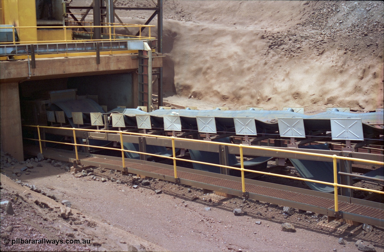 239-29
Yandi Two, conveyor belt CV202 failure to the belt on the primary crushing circuit. Shows belt rolls bunched up near exit from primary jaw type crusher. [url=https://goo.gl/maps/VrKABdiRp9P2]GeoData[/url].

