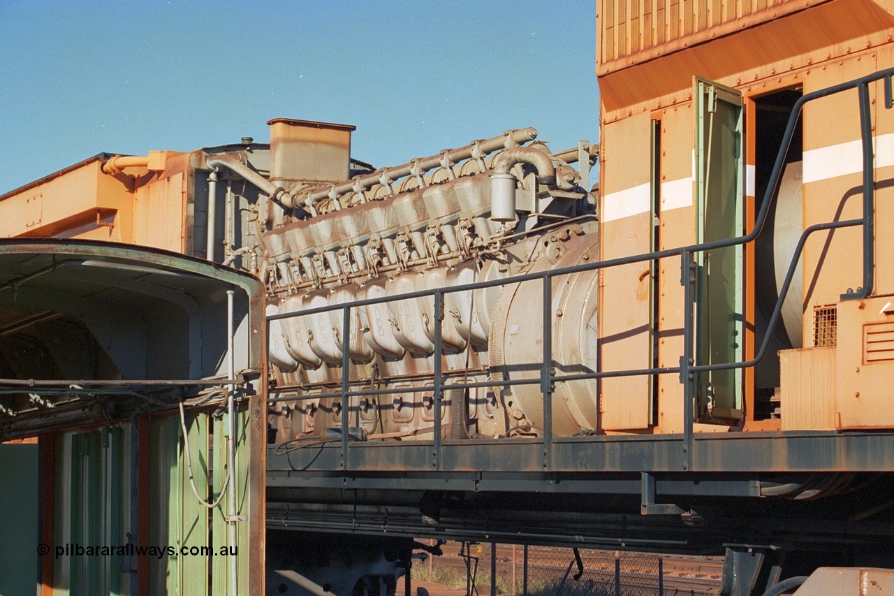 240-03
Nelson Point, retired Mt Newman Mining Comeng NSW built ALCo M636 unit 5499 serial C6096-4 sits with the hood removed exposing the ALCo 251F engine prior to removal and being sent by road to Rail Heritage WA's Bassendean museum for preservation. 25th June 2002.
Keywords: 5499;Comeng-NSW;MLW-ALCo;M636;C6096-4;251F;