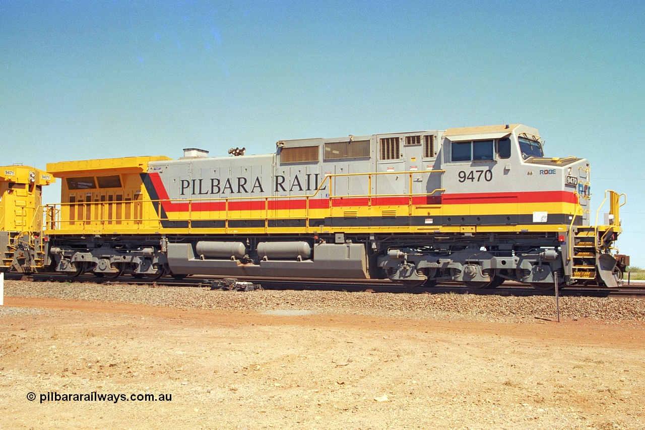 240-31
Seven Mile, Pilbara Rail, Robe River owned, General Electric built Dash 9-44CW unit 9470 serial 53455. This and sister units 9471 and 9472 were the first painted in the Pilbara Rail livery. 31st August 2002.
Keywords: 9470;GE;Dash-9-44CW;53455;