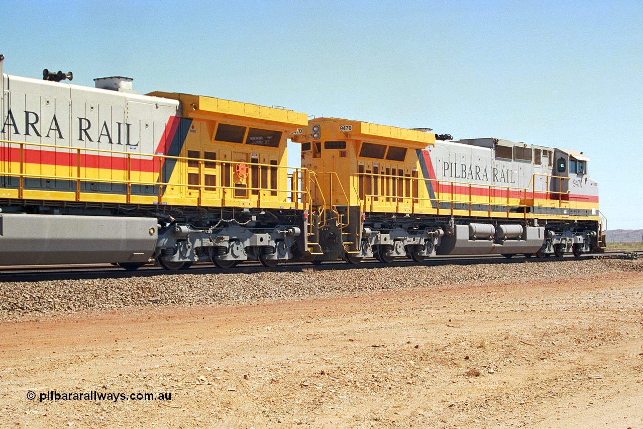 240-33
Seven Mile, trailing view of Pilbara Rail, Robe River owned, General Electric built Dash 9-44CW unit 9470 serial 53455. This and sister units 9471 and 9472 were the first painted in the Pilbara Rail livery. 31st August 2002.
Keywords: 9470;GE;Dash-9-44CW;53455;