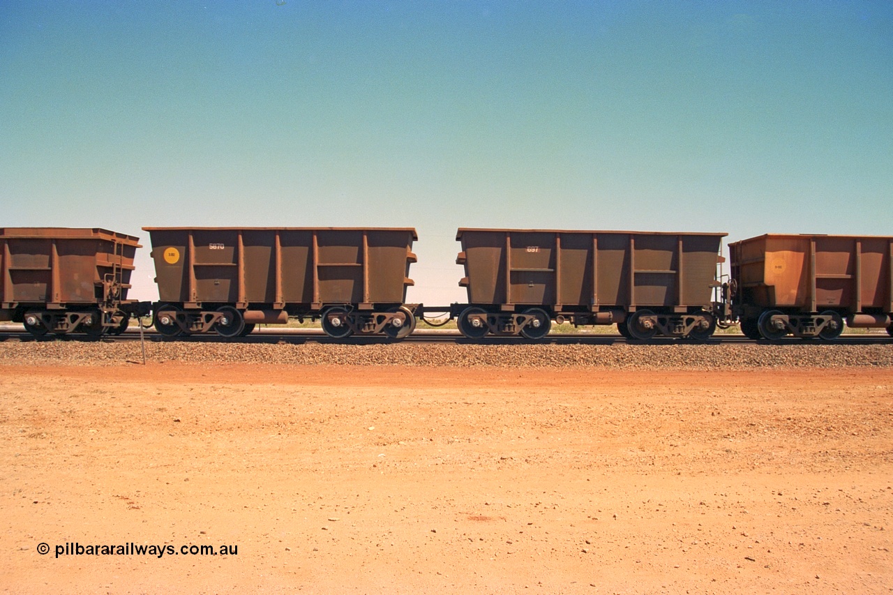 240-36
Seven Mile, a pair of re-walled Nippon Sharyo built waggons, control waggon 697 on the right with slave waggon 5870 on a loaded train bound of the Parker Point tippler. 31st August 2002.
Keywords: Nippon-Sharyo-Japan;
