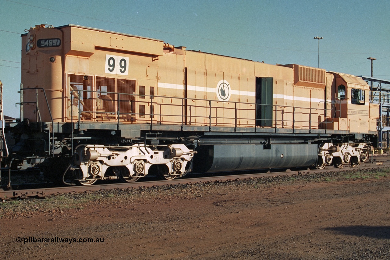 241-19
Nelson Point, Mt Newman Mining's last in-service ALCo M636 unit 5499 serial C6096-4 built by Comeng NSW sits awaiting partial dismantling before being sent by road to Rail Heritage WA's museum at Bassendean, Perth for preservation. Three quarter rear view. June 2002.
Keywords: 5499;Comeng-NSW;MLW-ALCo;M636;C6096-4;
