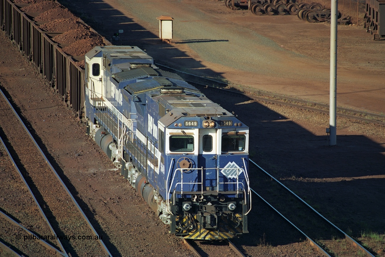 241-31
Nelson Point, Car Dumper 2 holding roads, a pair of CM40-8M units 5649 'Pohang' and 5640 'Ethel Creek' wait their turn through the dumper to discharge. June 2002.
Keywords: 5649;Goninan;GE;CM40-8M;8412-07/93-140;rebuild;AE-Goodwin;ALCo;M636C;5473;G6047-5;