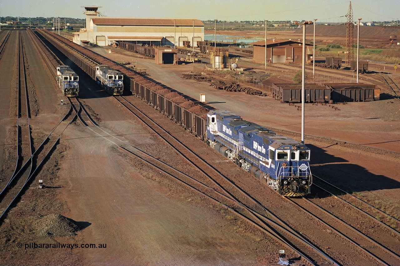 241-32
Nelson Point, Car Dumper 2 holding roads with Yard Control tower and Ore Car Repair Shop in the background as three loaded ore rakes behind a pair of CM40-8M units on each wait their turn through the dumper to discharge. June 2002.
Keywords: 5649;Goninan;GE;CM40-8M;8412-07/93-140;rebuild;AE-Goodwin;ALCo;M636C;5473;G6047-5;