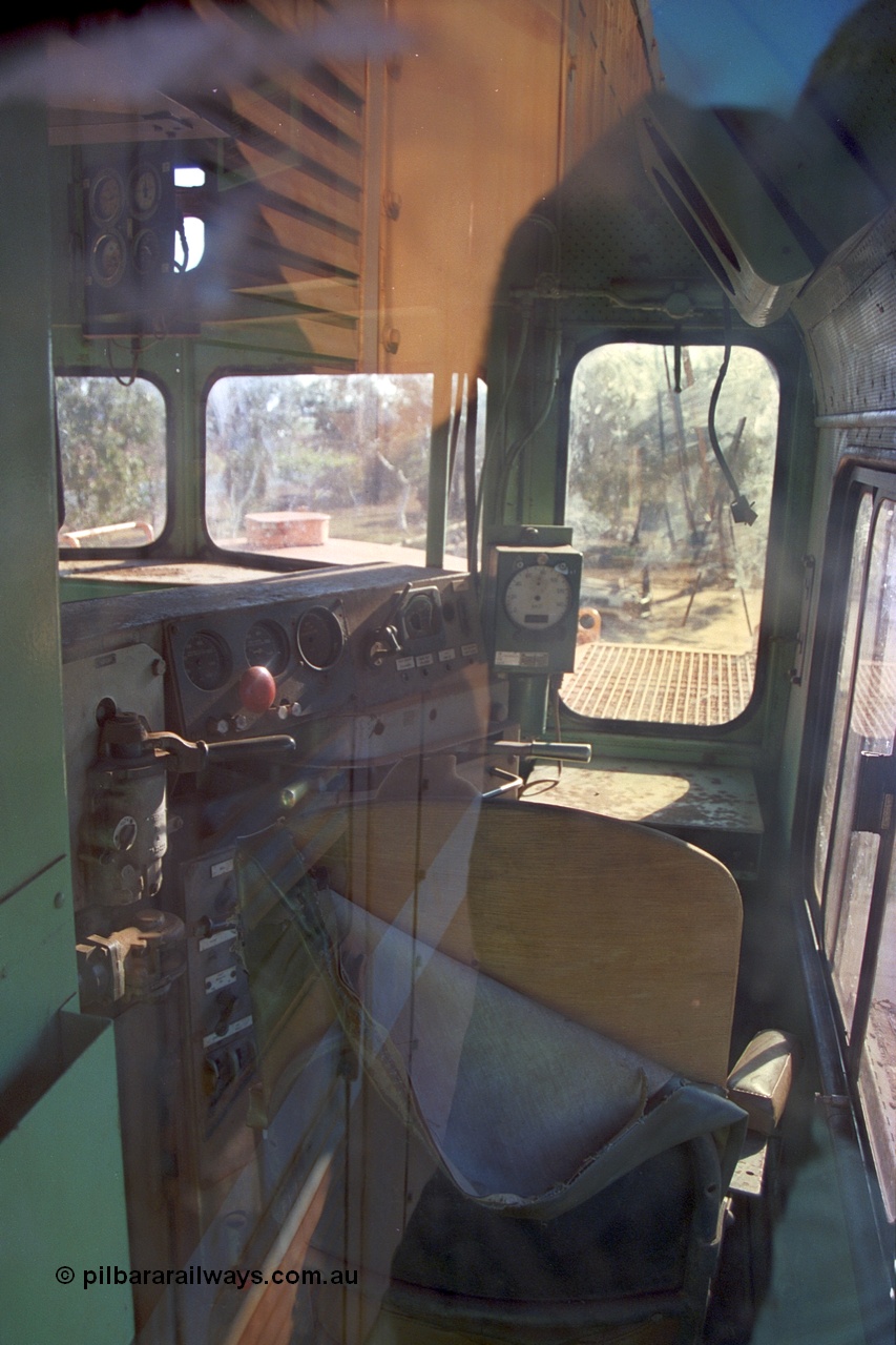 242-31
Port Hedland, Don Rhodes Mining Museum, preserved Mt Newman Mining Comeng NSW built ALCo M636 unit 5497 serial C6096-2, view looking into driving cab. May 2002.
Keywords: 5497;Comeng-NSW;MLW-ALCo;M636;C6096-2;