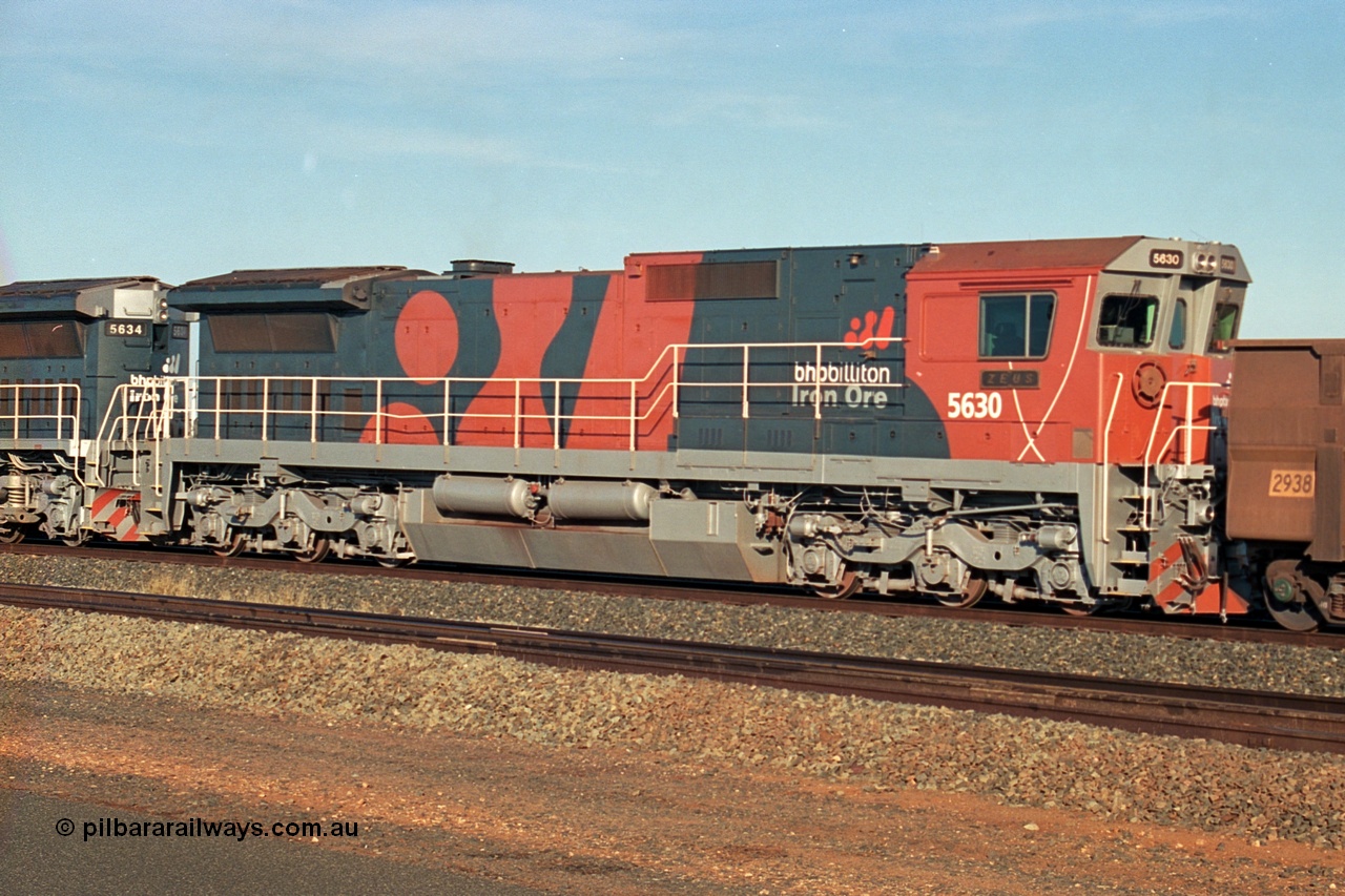 243-06
Nelson Point departure yard, BHP Billiton's CM39-8 unit 5630 'Zeus' serial 5831-09 / 88-079 and built new by Goninan trails CM40-8M unit 5634 both in the new 'earth' or 'bubble' livery as they head up an empty train waiting departure time. August 2003.
Keywords: 5630;Goninan;GE;CM39-8;5831-09/88-079;