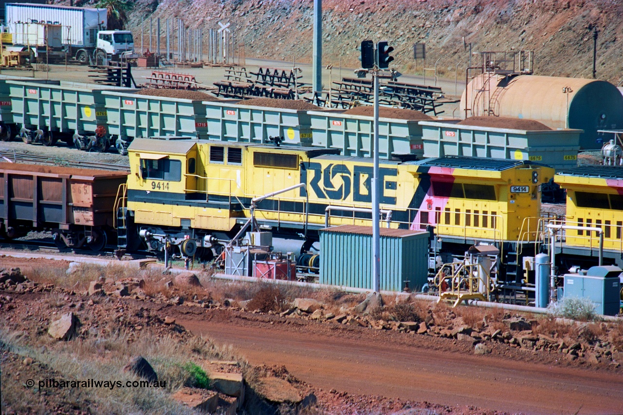 247-08
Cape Lambert fuel point, Robe River locomotive 9414 which is a Goninan WA ALCo to GE rebuild CM40-8M with serial 8206-11 / 91-124 from November 1991 riding on Dofasco bogies and was originally an AE Goodwin built M636 ALCo built new for Robe in December 1971 and numbered 262.005, later numbered 1714. Everything below the frame is ALCo while above is GE and Pilbara Cab. Approximate location of the locos is [url=https://goo.gl/maps/DEynwwkV9PZra5Gm7]here[/url]. 22nd May 2002.
Keywords: 9414;Goninan;GE;CM40-8M;8206-11/91-124;rebuild;AE-Goodwin;ALCo;M636;G6060-5;