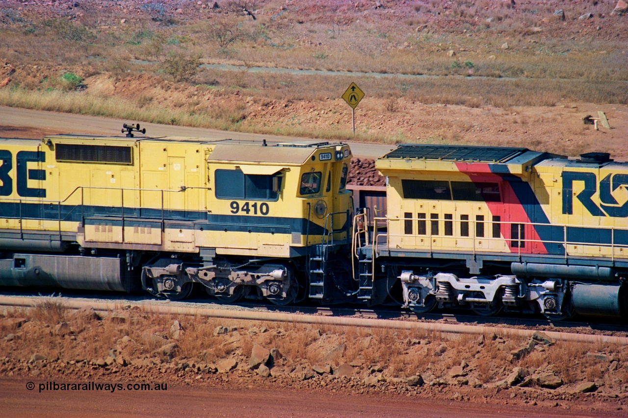 247-29
Cape Lambert fuel point, Robe River locomotive 9410 which is a Goninan WA ALCo to GE rebuild CM40-8M with serial 2160-03 / 96-202 from March 1996 riding on Dofasco bogies and was originally a Comeng NSW built M636 ALCo serial C-6096-5 and built new for Mt Newman Mining (later BHP Iron Ore) in November 1975 and numbered 5500. Everything below the frame is ALCo, with the Comeng build style flat fuel tank, while above is GE and Pilbara Cab. Approximate location of the locos is [url=https://goo.gl/maps/DEynwwkV9PZra5Gm7]here[/url]. 22nd May 2002.
Keywords: 9410;Goninan;GE;CM40-8M;2160-03/96-202;rebuild;Comeng-NSW;ALCo;M636;C-6096-5;