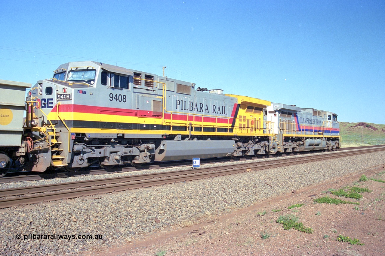 248-08
Dingo Siding on the Hamersley Iron railway at the 39 km with an empty train headed up by a pair of General Electric built Dash 9-44CW units 7077 serial 47756 from the original first order in the Pepsi Can livery and 9408 serial 54158 from the fourth order in the Pilbara Rail livery with Robe ownership markings. Approximate [url=https://goo.gl/maps/Jv752bD5KXv28oUV7]location[/url]. 24th April 2004.
Keywords: 9408;GE;Dash-9-44CW;54158;