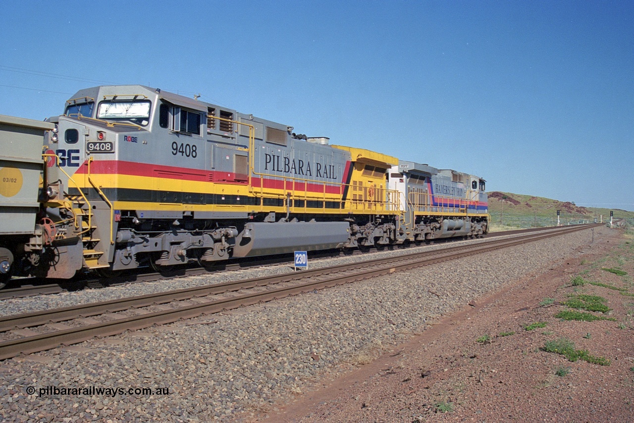 248-09
Dingo Siding on the Hamersley Iron railway at the 39 km with an empty train headed up by a pair of General Electric built Dash 9-44CW units 7077 serial 47756 from the original first order in the Pepsi Can livery and 9408 serial 54158 from the fourth order in the Pilbara Rail livery with Robe ownership markings. The signal marker boards are in the distance. Approximate [url=https://goo.gl/maps/Jv752bD5KXv28oUV7]location[/url]. 24th April 2004.
Keywords: 9408;GE;Dash-9-44CW;54158;