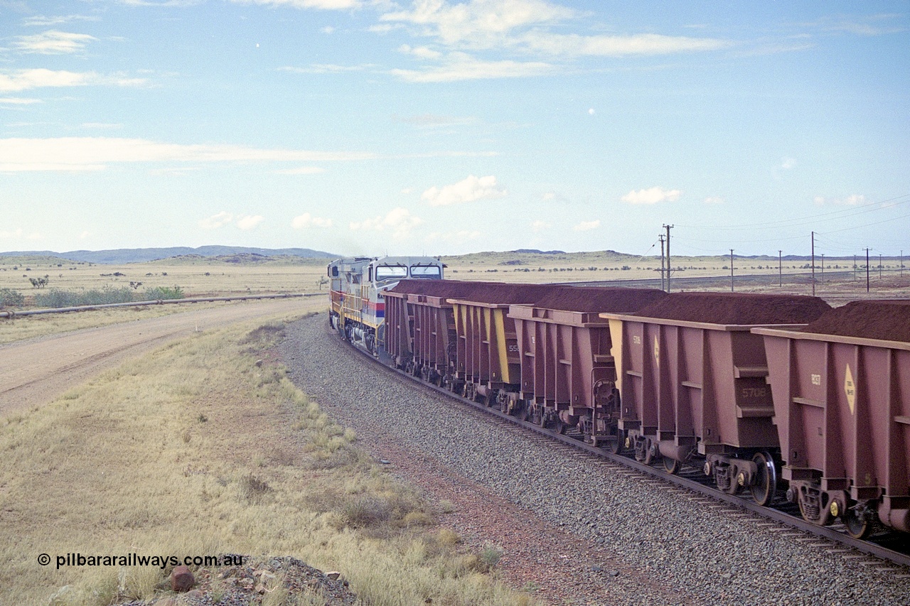 249-32
A loaded Hamersley Iron train runs across the plains north of Dugite Siding near the 70 km as it nears the destination of its cargo behind the standard pair of GE built Dash 9-44CW locomotives 7084 serial 47763 and 7079 serial 47758 both in the original Pepsi Can livery. Approximate [url=https://goo.gl/maps/UUfj15vTkvBaPCaw8]location[/url]. 18th December 1999.
Keywords: 7079;GE;Dash-9-44CW;47758;M-series;