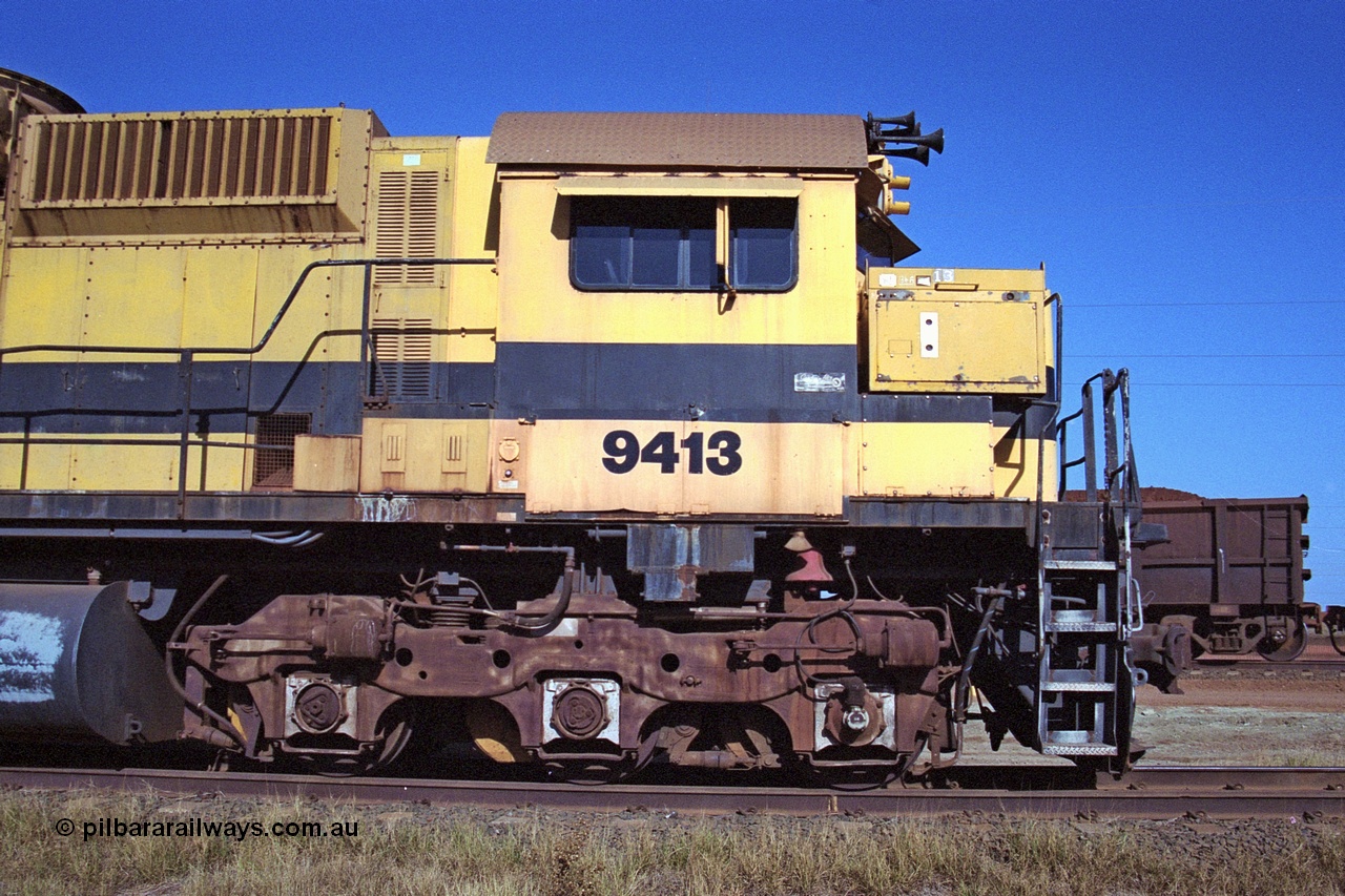 250-27
Cape Lambert yard on the Load Box Spur is recently stored Robe River AE Goodwin built ALCo M636 unit 9413 serial G6060-4 from December 1971, originally numbered 262.004 during construction, renumbered to 86-14-1713 with number boards 1713 and finally 9413. The ducting on the hood is the air to air intercooler modifications. 22nd October 2000.
Keywords: 9413;AE-Goodwin;MLW-ALCo;M636;G6060-4;