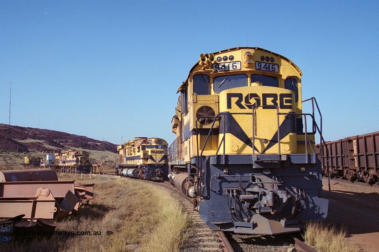 250-28
Cape Lambert Load Box Spur with Robe River's four remaining ALCo units recently stored out of service. 9416, 9413, 9515 in the load box and 9412 in the distance. 22nd October 2000.
Keywords: 9416;AE-Goodwin;MLW-ALCo;M636;G6046-16;