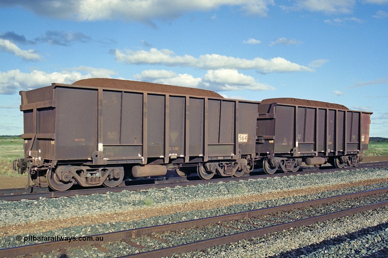 251-35
Walla Siding, two examples of BHP's ore waggon fleet of Comeng built waggons. The waggon closet to the camera has a new coupler fitted.

