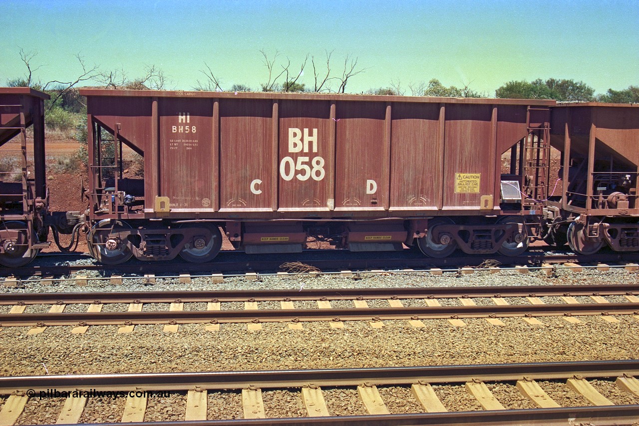 252-10
Cockatoo Siding 273 km on the Hamersley Iron line to Yandi, National Steel Car Company of Canada built ballast hopper waggon BH 058 built in January 1971. A batch of twenty were built for Hamersley Iron. Location is roughly [url=https://goo.gl/maps/gNdgoAj6uJoYb2q36]here[/url]. 24th November 2001.
Keywords: BH-type;BH058;National-Steel-Car-Canada;Rio-ballast-waggon;