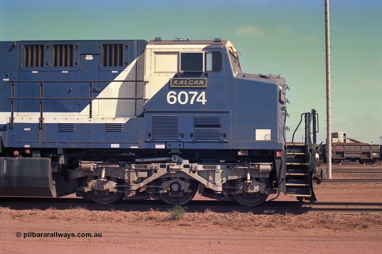 252-23
Nelson Point cab side view of BHP Iron Ore's General Electric built AC6000 unit 6074 'Kalgan' serial number 51066 is shutdown near the wheel lathe. Early December 2001.
Keywords: 6074;GE;AC6000;51066;
