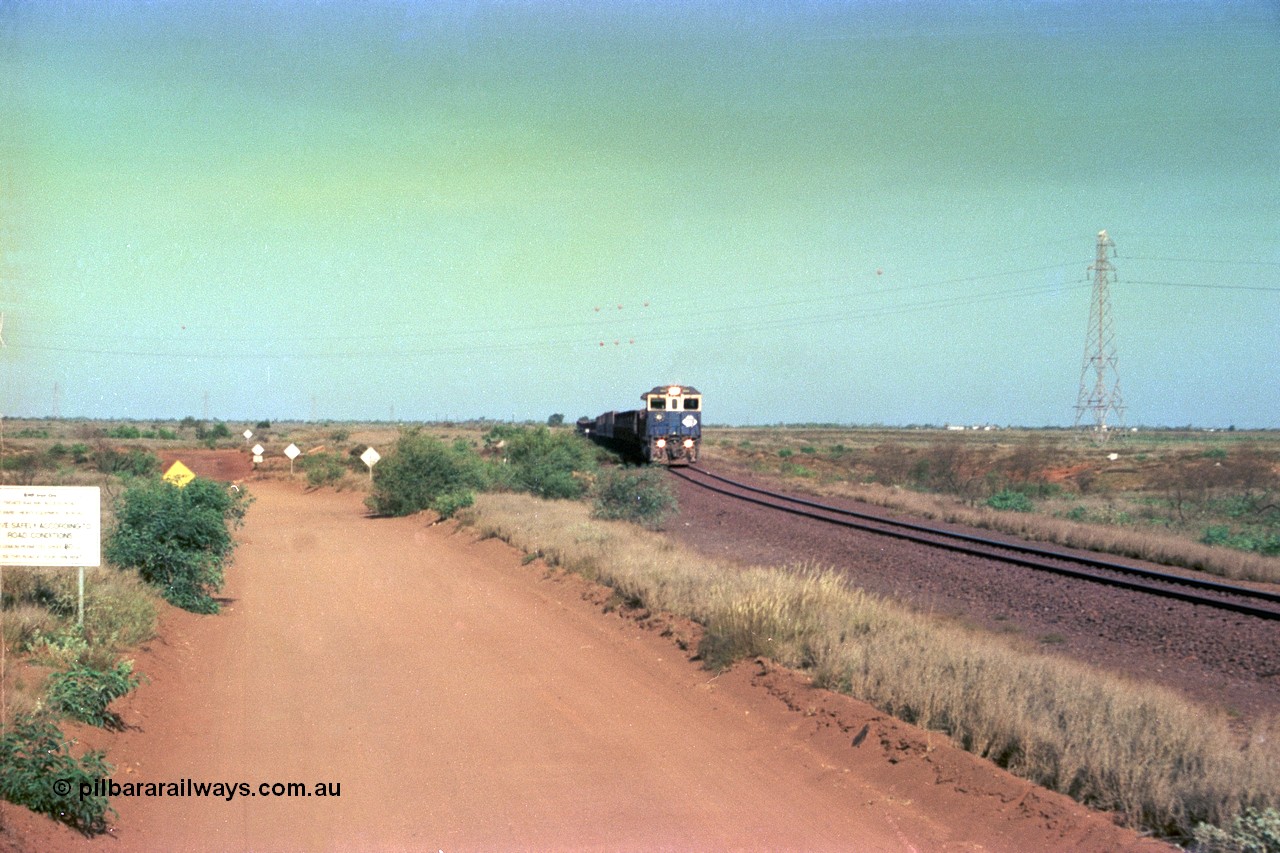 252-30
Port Hedland at 12 Mile Creek a loaded Yarrie train crosses over the creek behind Goninan CM40-8M GE rebuild unit 5645 'Sherlock' serial number 8281-11 / 92-134. Early December 2001.
Keywords: 5645;Goninan;GE;CM40-8M;8281-11/92-134;rebuild;AE-Goodwin;ALCo;M636C;5475;G6047-7;