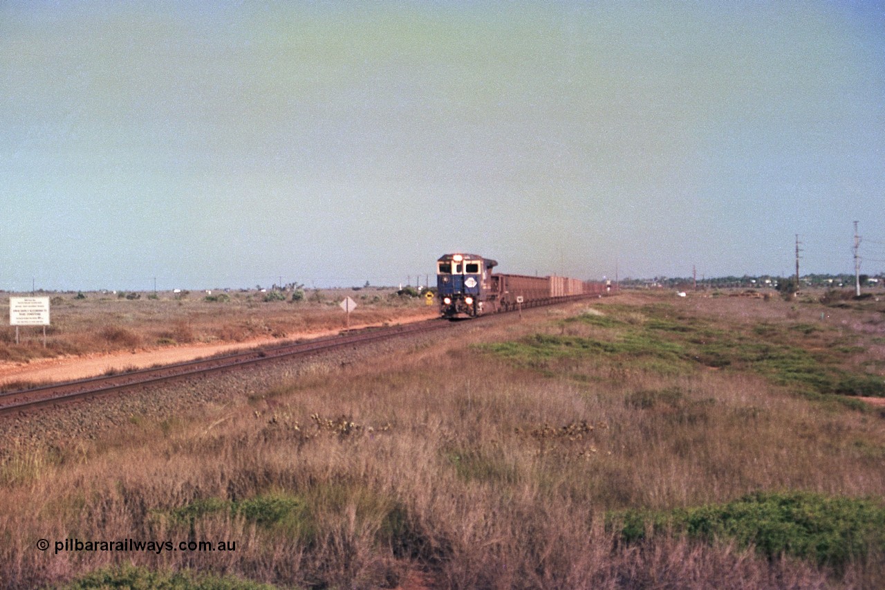 252-35
Boodarie, a loaded Yarrie train is crossing the Roebourne Rd at the 9.6 km behind Goninan CM40-8M GE rebuild unit 5645 'Sherlock' serial number 8281-11 / 92-134. Early December 2001.
Keywords: 5645;Goninan;GE;CM40-8M;8281-11/92-134;rebuild;AE-Goodwin;ALCo;M636C;5475;G6047-7;