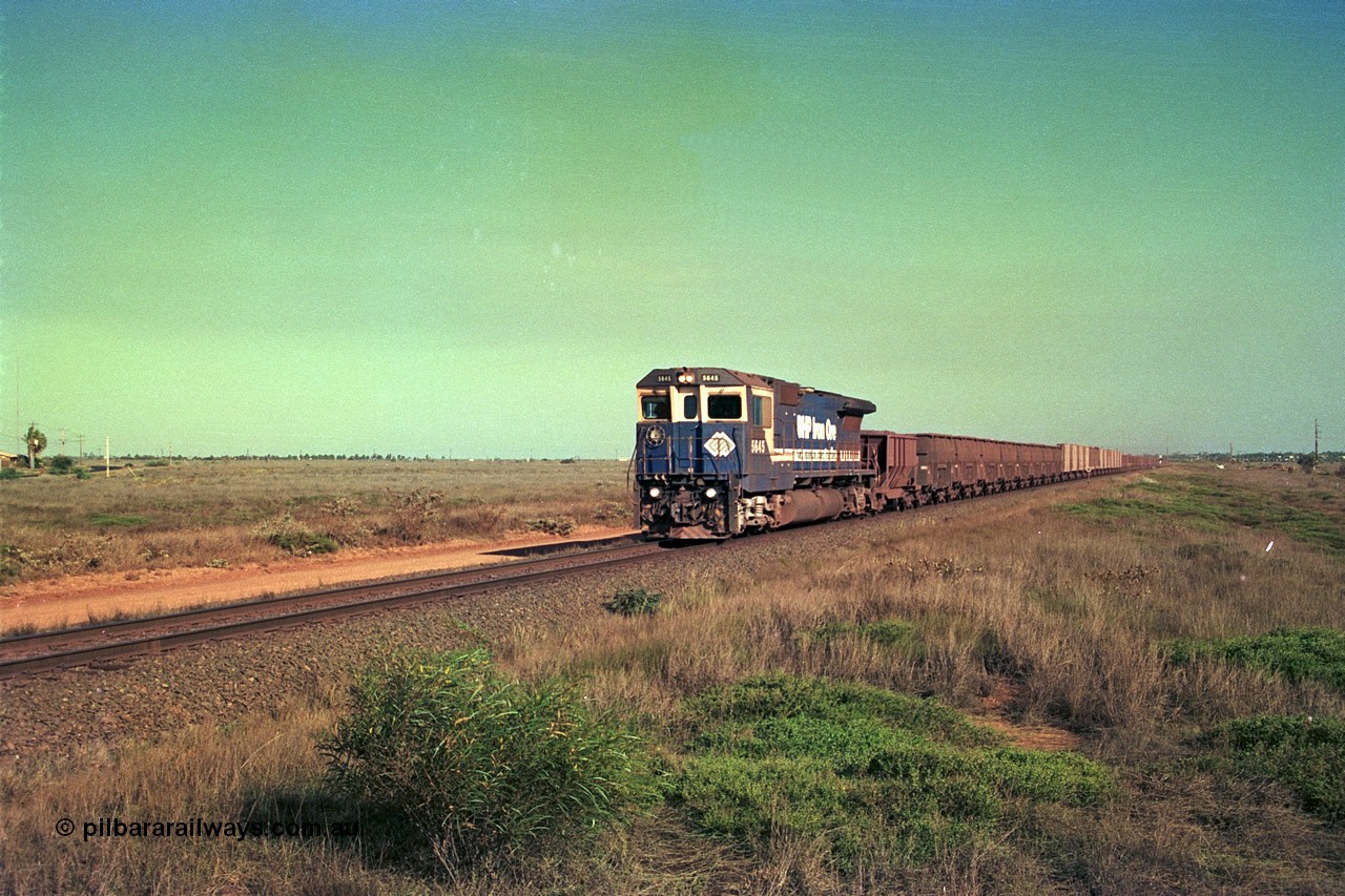 252-36
Boodarie, a loaded Yarrie train is crossing the Roebourne Rd at the 9.6 km behind Goninan CM40-8M GE rebuild unit 5645 'Sherlock' serial number 8281-11 / 92-134. Early December 2001.
Keywords: 5645;Goninan;GE;CM40-8M;8281-11/92-134;rebuild;AE-Goodwin;ALCo;M636C;5475;G6047-7;