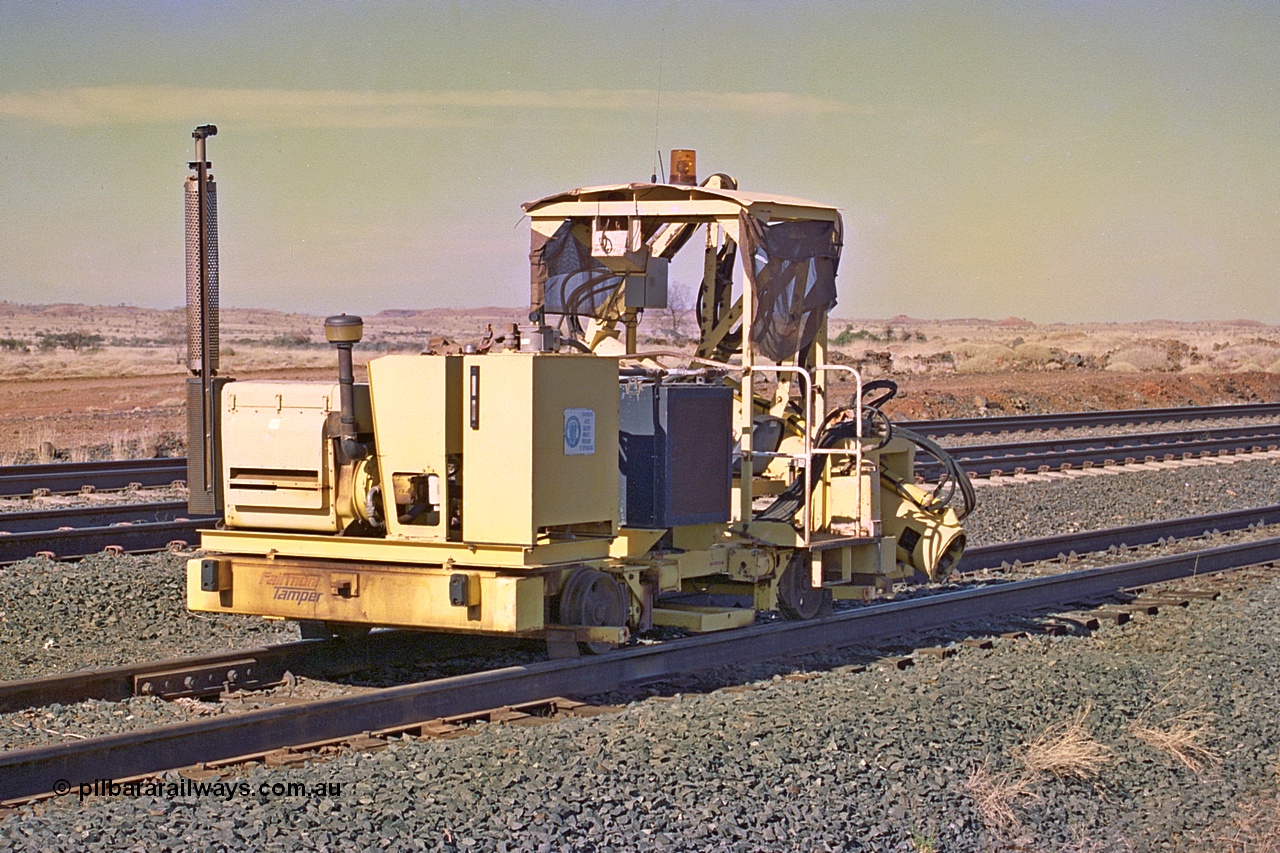 255-03
Siding Three back track, Fairmont Tamper sleeper inserter machine. May 2002.
