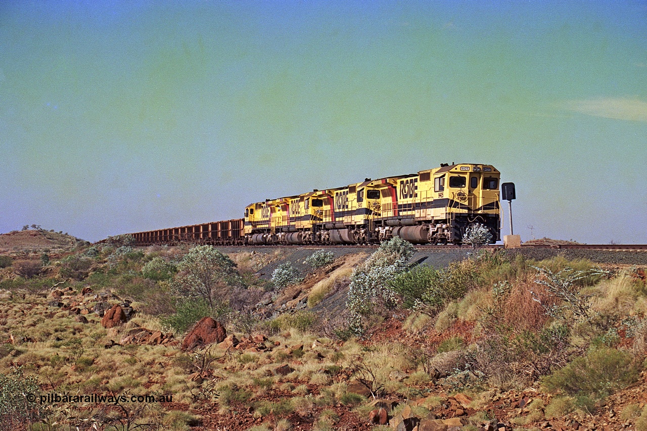 256-03
Maitland Siding on the Cape Lambert to Deepdale railway has a late afternoon empty train with the quad CM40-8M working of 9425, 9410, 9420 and 9414 in the siding waiting for a cross with an opposing loaded train. At the time of this image Siding 3 or Murray Camp was unable to cross ore trains so Siding One - Harding or Siding Two - Maitland were used. May 2002.
Keywords: 9425;Goninan;GE;CM40-8M;6266-8/89-85;rebuild;AE-Goodwin;ALCo;M636;G-6041-4;