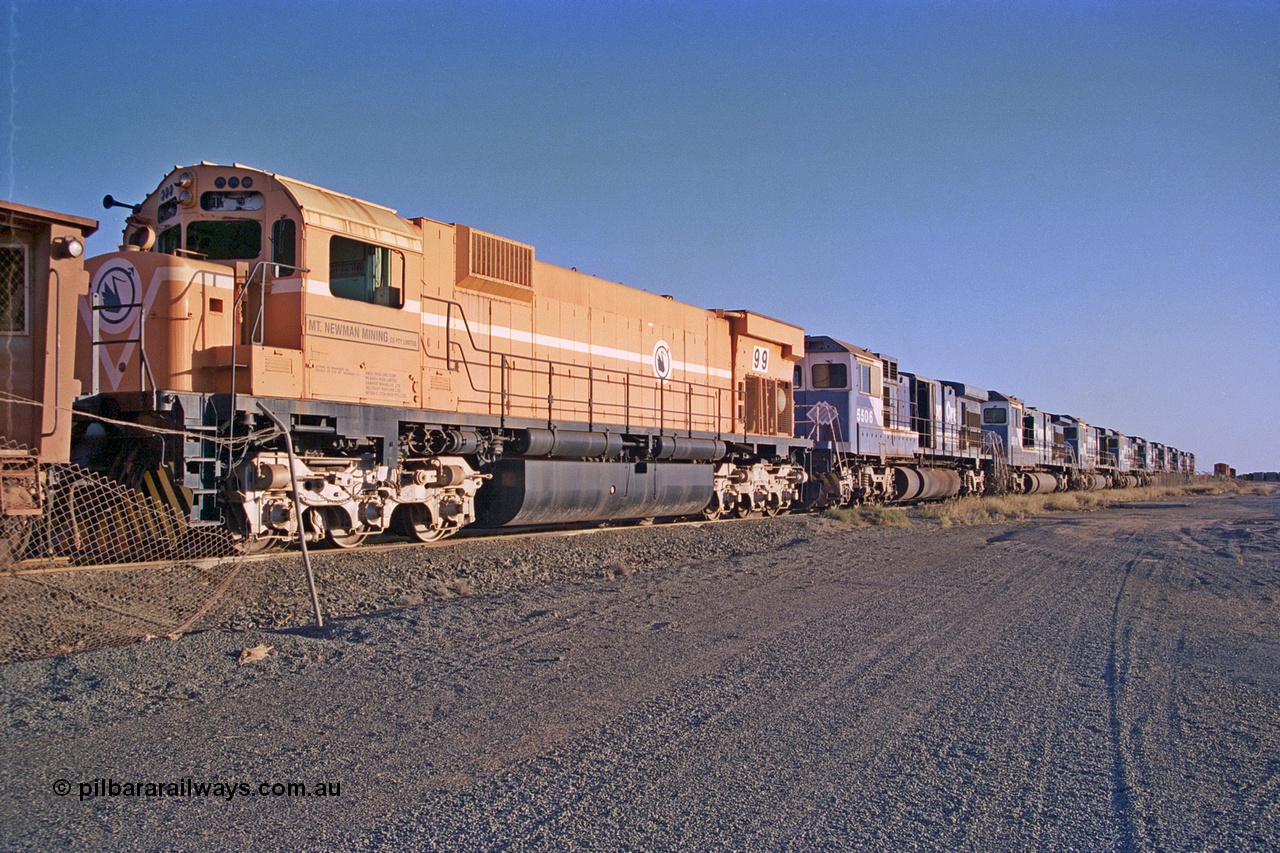 257-16
Flash Butt yard, line up of retired power, the final Comeng NSW built ALCo M636 unit 5499 serial number C6096-4 in Mount Newman Mining livery and then the eight withdrawn Goninan ALCo to GE rebuild C36-7M units 5506, 5510, 5512, 5511, 5513, 5507, 5509 and 5508. Late 2001.
Keywords: 5499;Comeng-NSW;MLW-ALCo;M636;C6096-4;