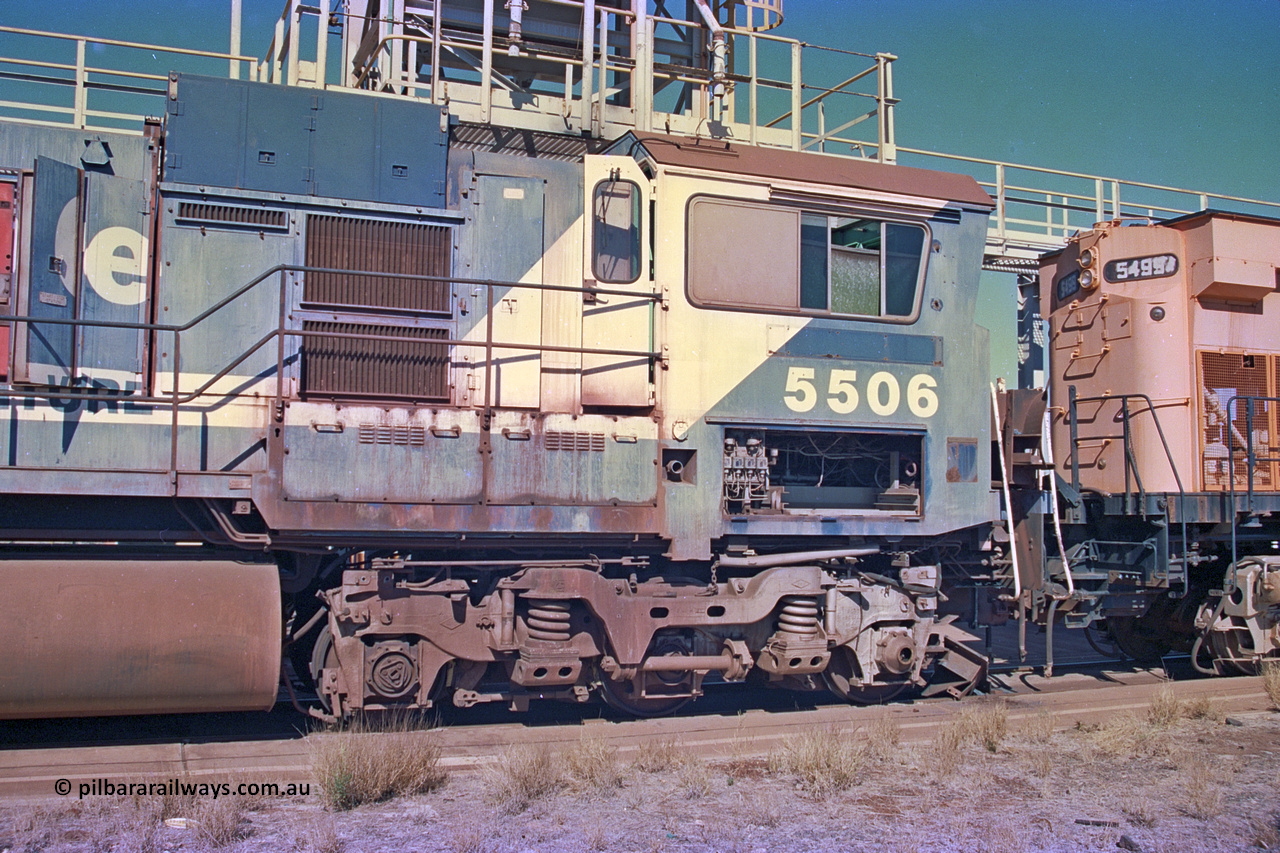 258-17
Nelson Point, old Loc Prep. Goninan GE rebuild C36-7M unit 5506 serial 4839-01 / 87-071 is waiting to be removed from site bound for Asset Kinetics in Maddington, Perth. Drivers cab side view. 5506 was rebuilt from NSW AE Goodwin built C636 ALCo number 5455 serial G6012-04 and was delivered in Mt Newman orange livery and originally named 'Mt Whaleback', after repainting into BHP blue was named 'Ethel Creek', then finally 'Mt Goldsworthy'. May 2002.
Keywords: 5506;Goninan;GE;C36-7M;4839-01/87-071;rebuild;AE-Goodwin;ALCo;C636;5455;G6012-4;