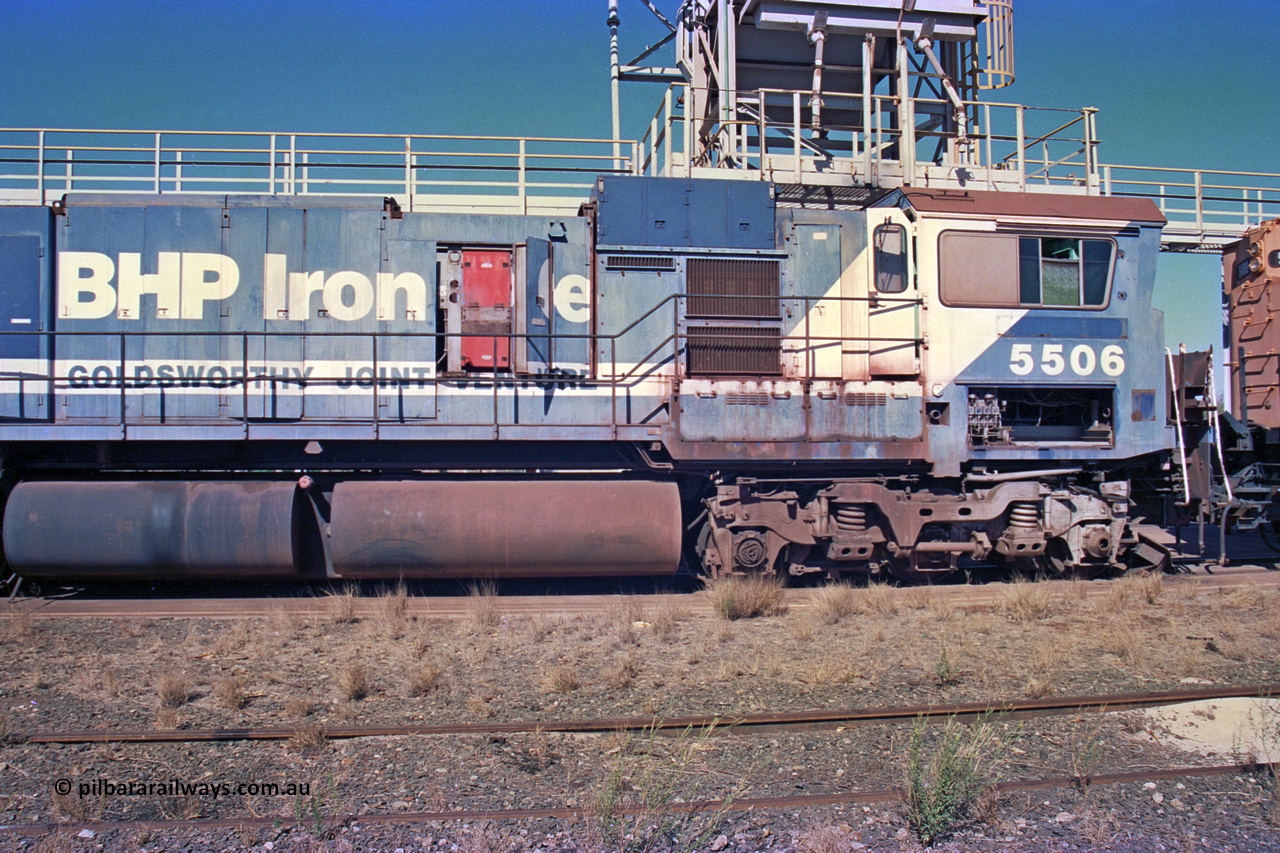 258-20
Nelson Point, old Loc Prep. Goninan GE rebuild C36-7M unit 5506 serial 4839-01 / 87-071 is waiting to be removed from site bound for Asset Kinetics in Maddington, Perth. Drivers cab side view. 5506 was rebuilt from NSW AE Goodwin built C636 ALCo number 5455 serial G6012-04 and was delivered in Mt Newman orange livery and originally named 'Mt Whaleback', after repainting into BHP blue was named 'Ethel Creek', then finally 'Mt Goldsworthy'. May 2002.
Keywords: 5506;Goninan;GE;C36-7M;4839-01/87-071;rebuild;AE-Goodwin;ALCo;C636;5455;G6012-4;