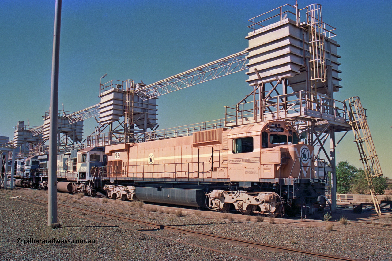 258-24
Nelson Point, old Loco Prep, Mt Newman Mining's last in-service ALCo M636 unit 5499 serial C6096-4 built by Comeng NSW sits awaiting partial dismantling before being sent by road to Rail Heritage WA's museum at Bassendean, Perth for preservation. Behind it are C36-7M units 5506 and 5510, both of which went to Asset Kinetics. May 2002.
Keywords: 5499;Comeng-NSW;MLW-ALCo;M636;C6096-4;
