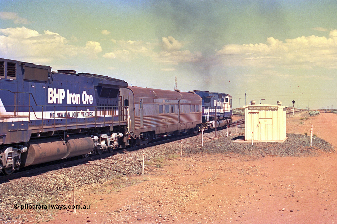 267-23
Goldsworthy Junction, CM40-8M GE rebuild unit 5634 'Boodarie' serial number 8151-07 / 91-120 turns on the power as it passes Goldsworthy Junction relay room and continues along the Newman Mainline with the Sundowner and sister unit 5653. The realigned former Goldsworthy line to the Yarrie and Nimingarra mines can be seen curving away to the left in front of 5634. Friday 12th of April 2002.
Keywords: 5634;Goninan;GE;CM40-8M;8151-07/91-120;rebuild;AE-Goodwin;ALCo;C636;5457;G6027-1;