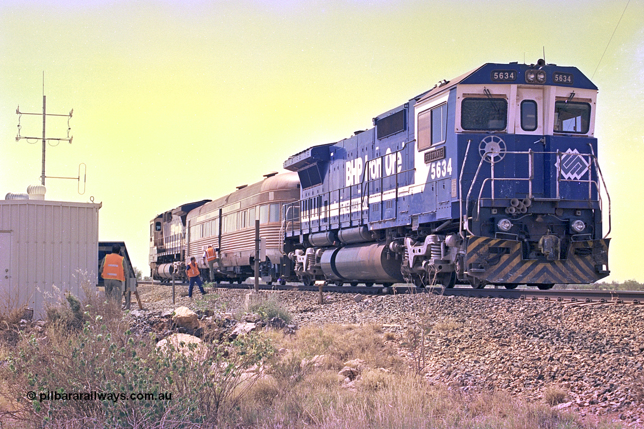 267-35
At the 39 km detection site with the Alstom 25-year service agreement special, BHP Iron Ore's Goninan GE rebuild CM40-8M unit 5634 'Boodarie' serial number 8151-07 / 91-120 stands on the Newman mainline with the train as the party alight for an inspection of the site. Friday 12th of April 2002.
Keywords: 5634;Goninan;GE;CM40-8M;8151-07/91-120;rebuild;AE-Goodwin;ALCo;C636;5457;G6027-1;