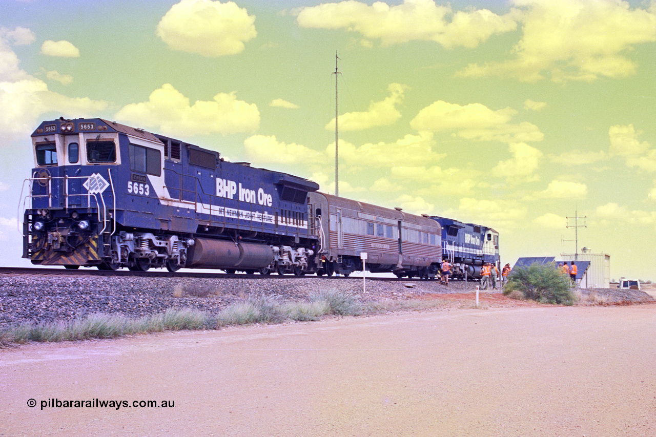 268-02
At the 39 km detection site with the Alstom 25-year service agreement special, BHP Iron Ore's Goninan GE rebuild CM40-8M unit 5653 'Chiba' serial number 8412-10 / 93-144 stands on the Newman mainline with The Sundowner and 5634 on the rear of the train as the party conducts an inspection of the site. Friday 12th of April 2002.
Keywords: 5653;Goninan;GE;CM40-8M;8412-10/93-144;rebuild;AE-Goodwin;ALCo;M636C;5484;G6061-5;