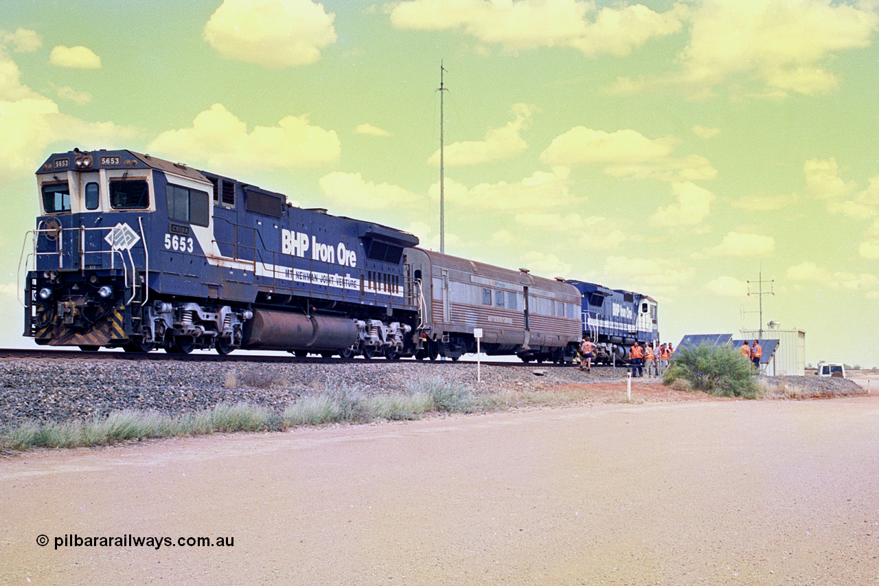 268-03
At the 39 km detection site with the Alstom 25-year service agreement special, BHP Iron Ore's Goninan GE rebuild CM40-8M unit 5653 'Chiba' serial number 8412-10 / 93-144 stands on the Newman mainline with The Sundowner and 5634 on the rear of the train as the party conducts an inspection of the site. Friday 12th of April 2002.
Keywords: 5653;Goninan;GE;CM40-8M;8412-10/93-144;rebuild;AE-Goodwin;ALCo;M636C;5484;G6061-5;