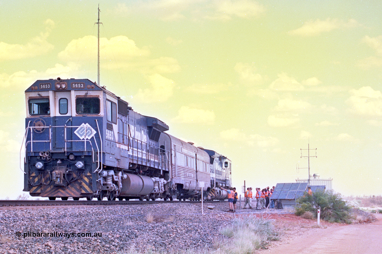 268-05
At the 39 km detection site with the Alstom 25-year service agreement special, BHP Iron Ore's Goninan GE rebuild CM40-8M unit 5653 'Chiba' serial number 8412-10 / 93-144 stands on the Newman mainline with The Sundowner and 5634 on the rear of the train as the party conducts an inspection of the site. Friday 12th of April 2002.
Keywords: 5653;Goninan;GE;CM40-8M;8412-10/93-144;rebuild;AE-Goodwin;ALCo;M636C;5484;G6061-5;