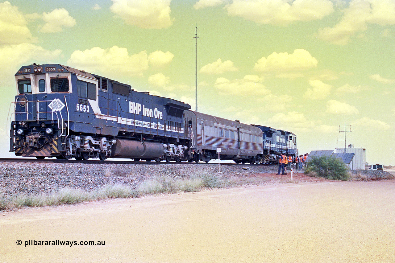 268-09
At the 39 km detection site with the Alstom 25-year service agreement special, BHP Iron Ore's Goninan GE rebuild CM40-8M unit 5653 'Chiba' serial number 8412-10 / 93-144 stands on the Newman mainline with The Sundowner and 5634 on the rear of the train as the party conducts an inspection of the site. Friday 12th of April 2002.
Keywords: 5653;Goninan;GE;CM40-8M;8412-10/93-144;rebuild;AE-Goodwin;ALCo;M636C;5484;G6061-5;
