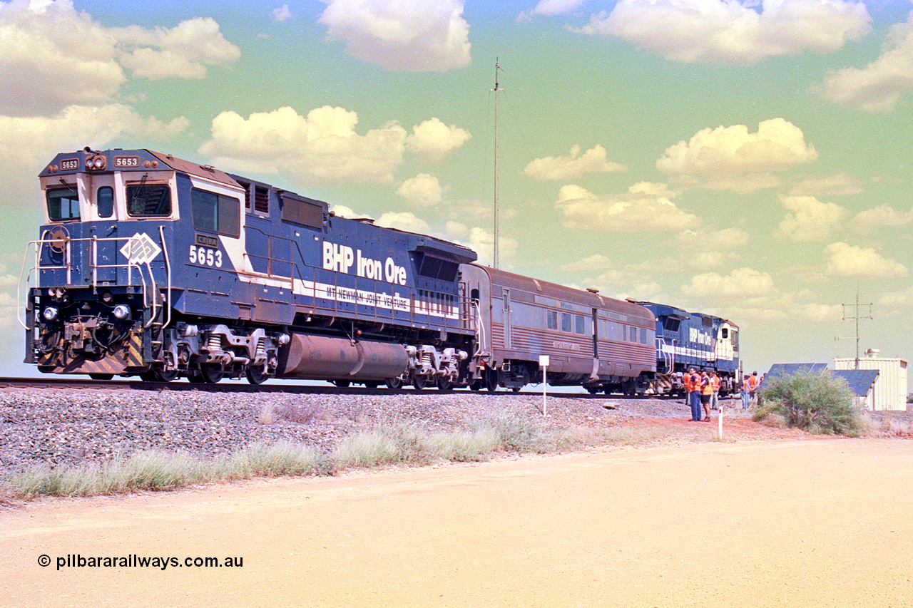 268-11
At the 39 km detection site with the Alstom 25-year service agreement special, BHP Iron Ore's Goninan GE rebuild CM40-8M unit 5653 'Chiba' serial number 8412-10 / 93-144 stands on the Newman mainline with The Sundowner and 5634 on the rear of the train as the party conducts an inspection of the site. Friday 12th of April 2002.
Keywords: 5653;Goninan;GE;CM40-8M;8412-10/93-144;rebuild;AE-Goodwin;ALCo;M636C;5484;G6061-5;