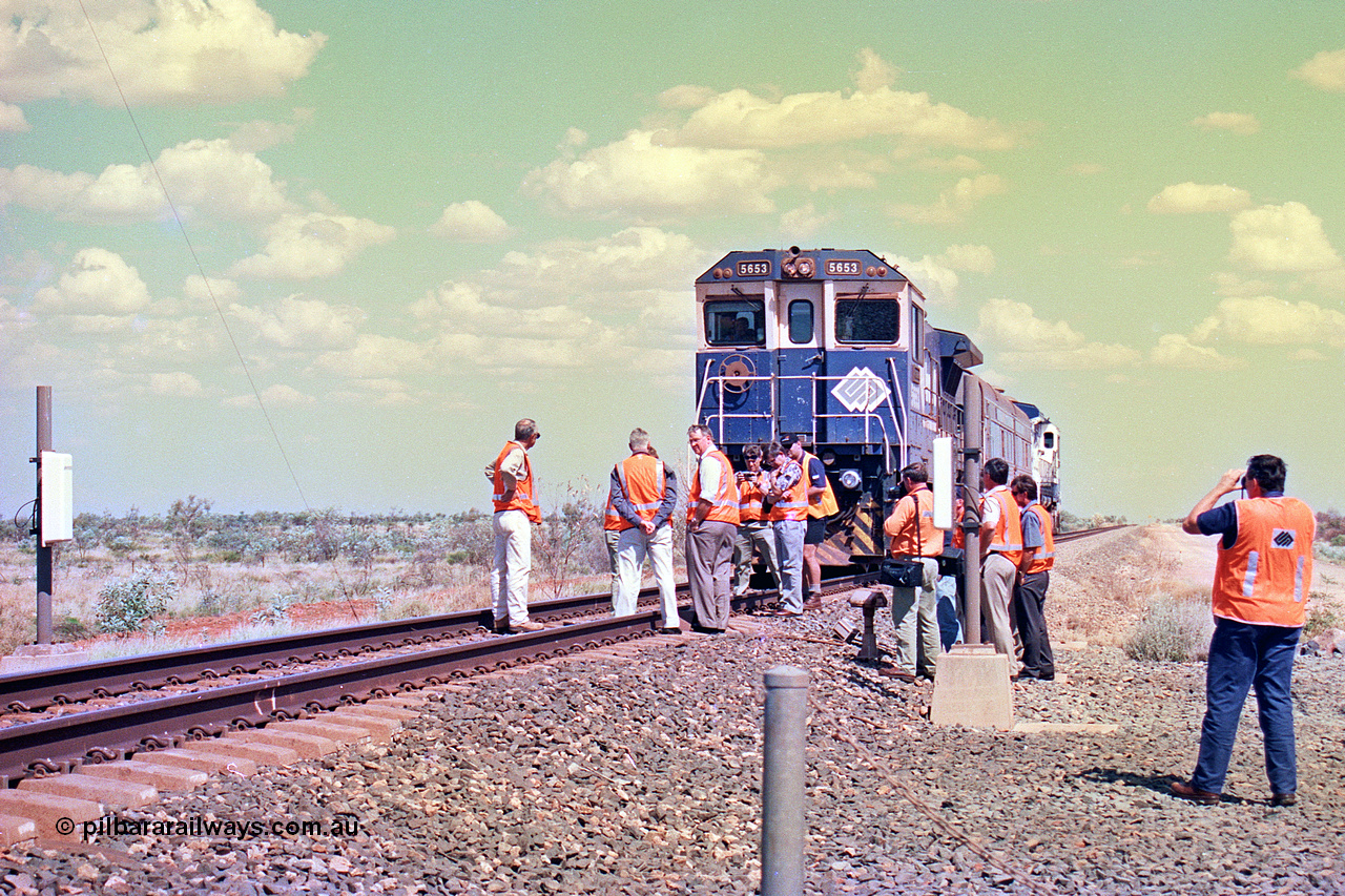 268-26
At the 39 km detection site with the Alstom 25-year service agreement special, BHP Iron Ore's Goninan GE rebuild CM40-8M unit 5653 'Chiba' serial number 8412-10 / 93-144 stands on the Newman mainline with The Sundowner and 5634 on the rear of the train as the party conducts an inspection of the site. Friday 12th of April 2002.
Keywords: 5653;Goninan;GE;CM40-8M;8412-10/93-144;rebuild;AE-Goodwin;ALCo;M636C;5484;G6061-5;