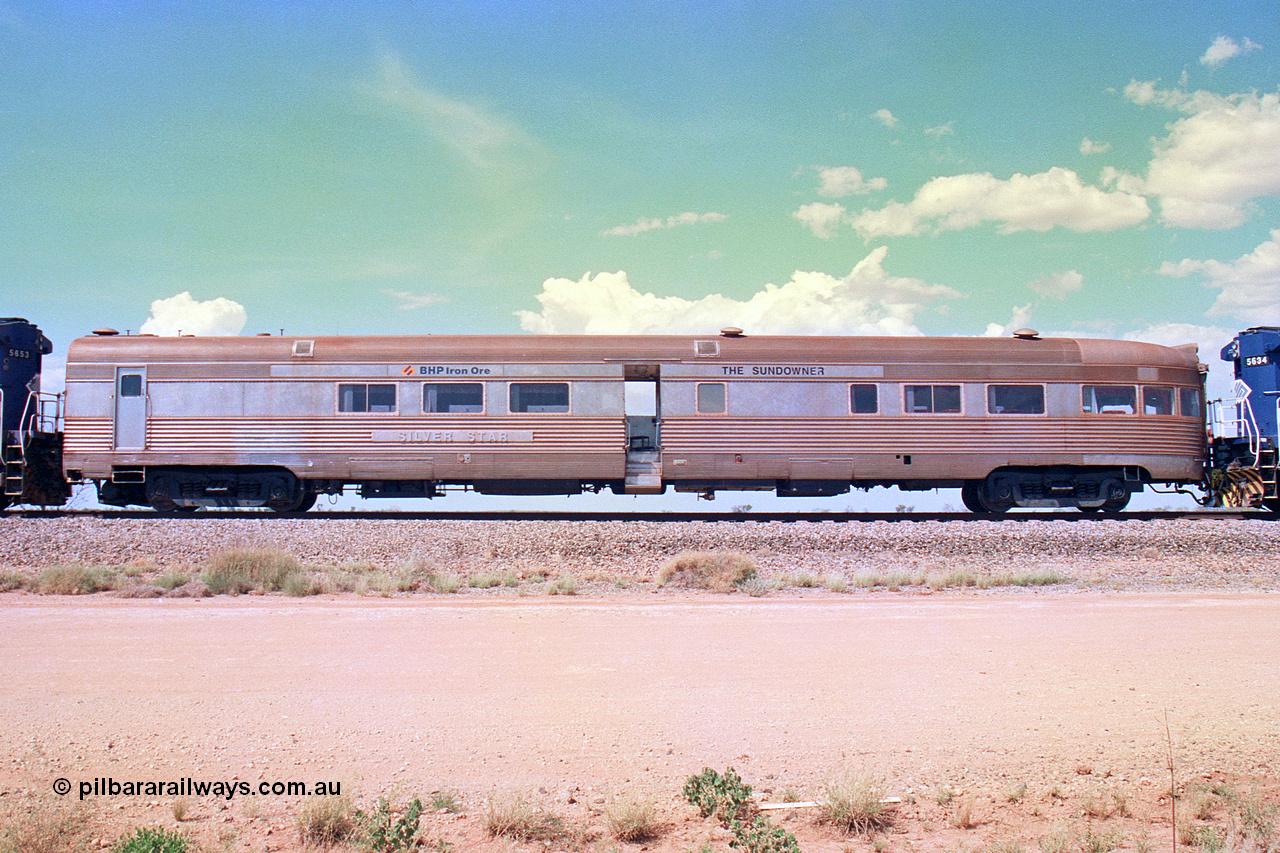 268-29
At the 39 km detection site with the Alstom 25-year special, left hand side view of the Sundowner coach, originally built by E. G. Budd in 1939 numbered 301 as the Silver Star, a diner-parlour-observation coach on the Chicago, Burlington and Quincy Railroad's General Pershing Zephyr train from the 1930s and 1940s. Donated to Mt Newman Mining Co. by AMAX an original joint venture partner to commemorate the projects first 100 million tonnes of iron ore railed between Mount Whaleback mine and the Port Hedland port. 12th of April 2002.
Keywords: Silver-Star;EG-Budd;Sundowner;General-Pershing-Zephyr;301;