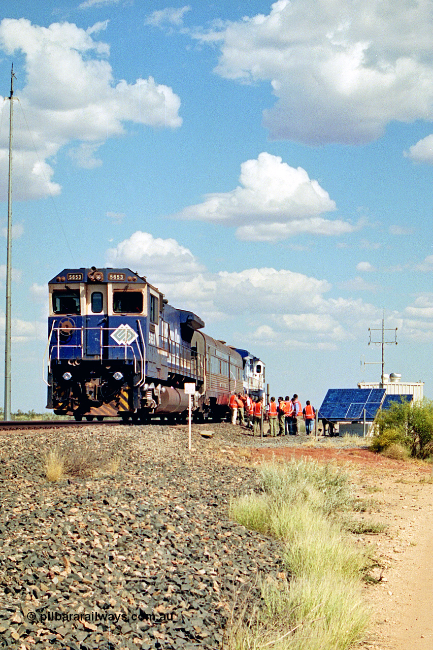 269-06
At the 39 km detection site with the Alstom 25-year service agreement special, BHP Iron Ore's Goninan GE rebuild CM40-8M unit 5653 'Chiba' serial number 8412-10 / 93-144 stands on the Newman mainline with The Sundowner and 5634 on the rear of the train as the party conducts an inspection of the site. Friday 12th of April 2002.
Keywords: 5653;Goninan;GE;CM40-8M;8412-10/93-144;rebuild;AE-Goodwin;ALCo;M636C;5484;G6061-5;