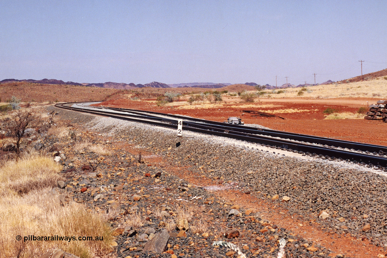 283-12
Harding Siding on the Robe River line at the 42 kilometre post looking in the down direction towards Deepdale. Recently extended north end of the siding to accommodate the soon to be West Angelas traffic and longer trains. 22nd of May 2002.
