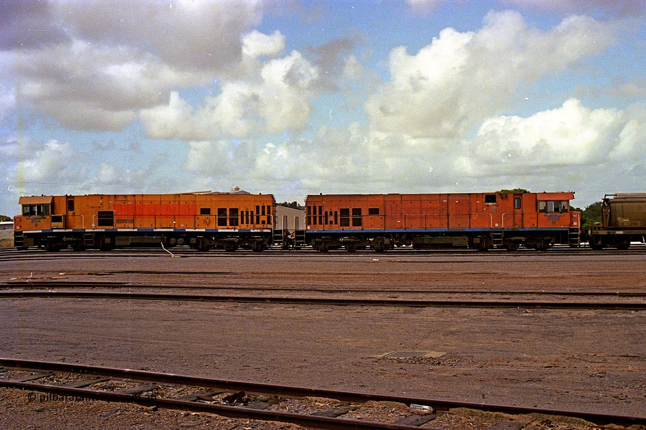 284-10
Narngulu, Geraldton, former Westrail P class loco P 2014 'Shire of Wongan-Ballidu' built by Goninan WA as a GE CM25-8 model with serial number 6320-12 / 90-099 sits in the yard on empty grain waggons with sister loco P 2003. November 9, 2004.
Keywords: P-class;P2014;Goninan-WA;GE;CM25-8;6320-12/90-099;
