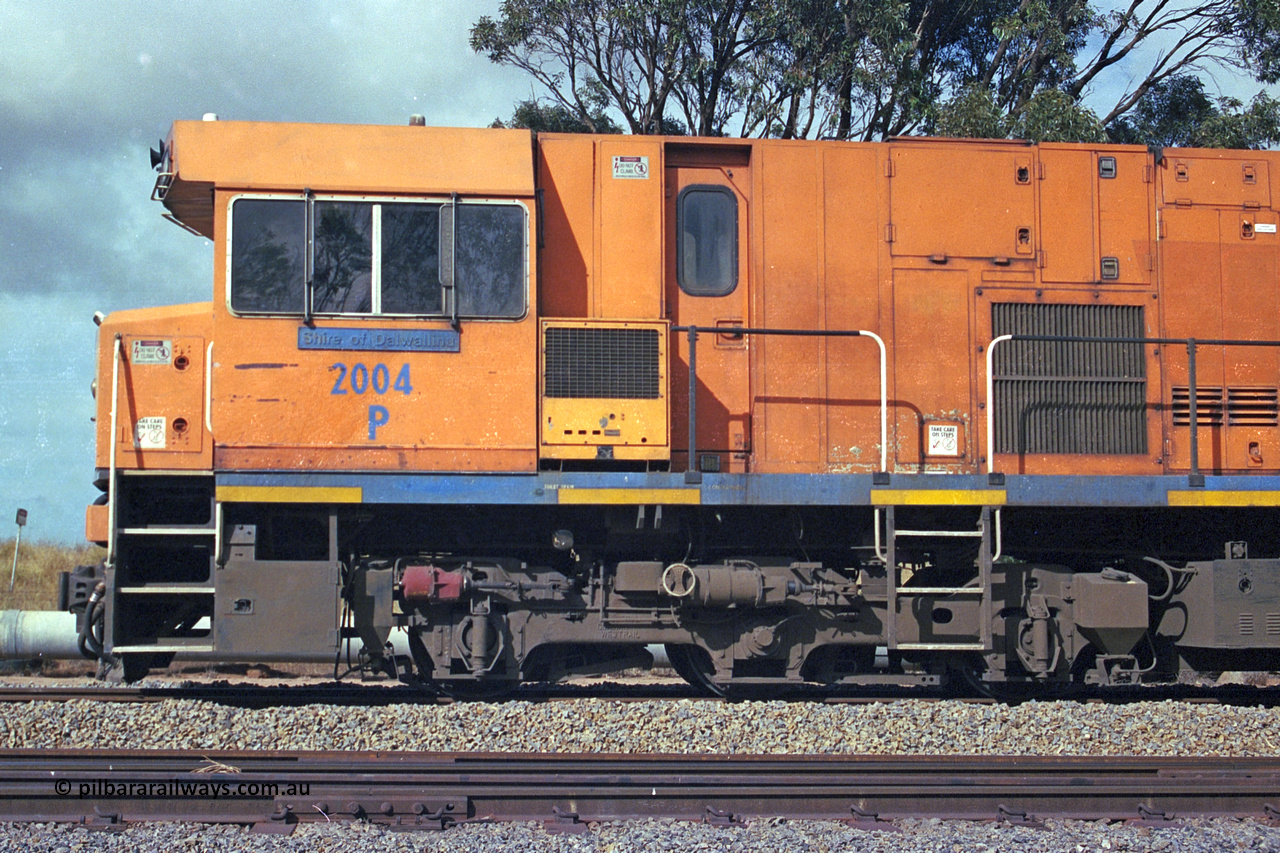 284-21
Narngulu, Geraldton, former Westrail P class loco P 2004 'Shire of Dalwallinu' built by Goninan WA as a GE CM25-8 model with serial number 6320-12 / 90-099 sits in the yard on empty mineral sand train waiting to run to Eneabba. November 9, 2004.
Keywords: P-class;P2004;Goninan-WA;GE;CM25-8;6320-03/90-089;